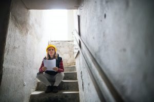Home inspector reviewing a basement foundation during a foundation inspection services near you evaluation to identify structural issues.