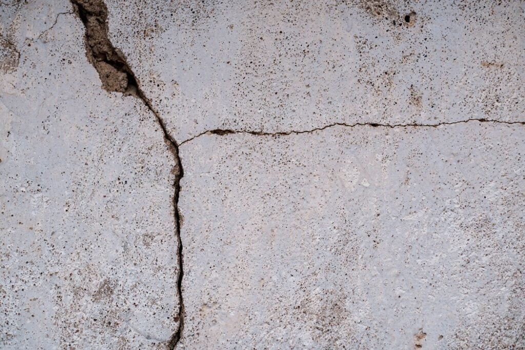 Crack X technician inspecting hairline and structural foundation floor cracks