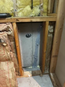 Repaired vertical foundation wall crack with epoxy injection inside a basement in Wilmington, MA