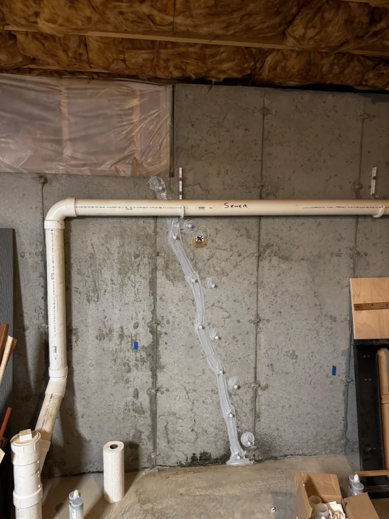 Professional basement crack repair New Hampshire project featuring polyurethane crack injection to permanently seal a leaking concrete foundation wall.