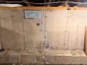 Completed foundation wall crack repair in a South Portland, ME basement using professional crack injection to permanently seal a leaking concrete foundation crack.