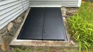 Old rusty bulkhead door before replacement in North Andover, MA