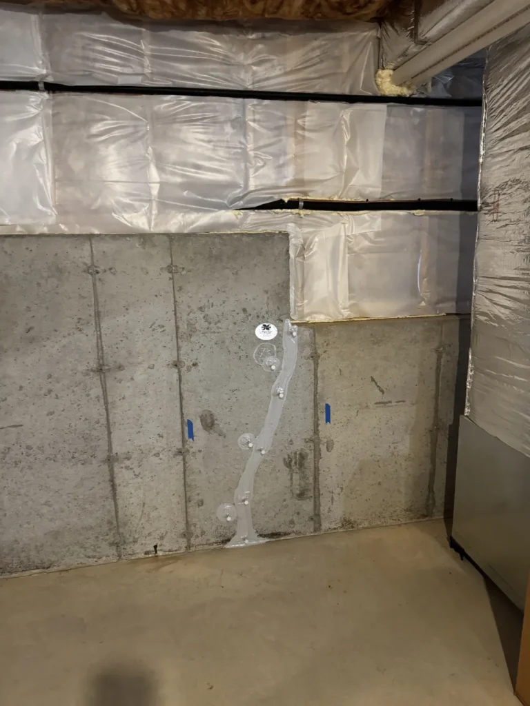 Basement waterproofing and crack repair solutions using polyurethane injection to seal a vertical foundation wall crack and prevent water intrusion.