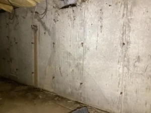 before foundation wall crack repair with injection ports and sealant in a Portsmouth, NH crawlspace.