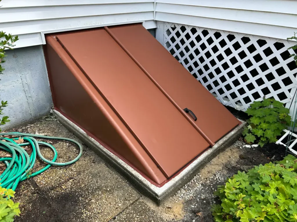 New brown basement bulkhead door installed by CrackX in Methuen, MA