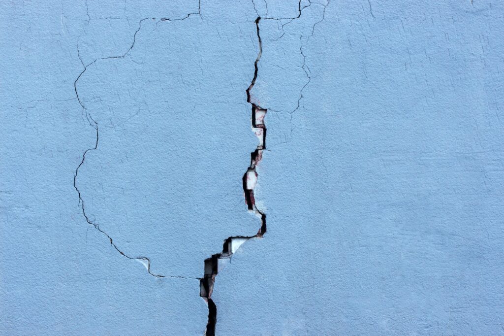 Large vertical foundation wall crack illustrating basement repair cost concerns and the need for professional foundation crack repair.