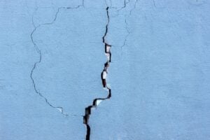 Large vertical foundation wall crack illustrating basement repair cost concerns and the need for professional foundation crack repair.