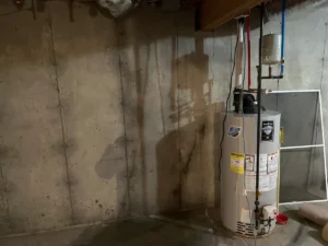 Leaking foundation wall crack extending from a beam pocket in a Litchfield, NH basement